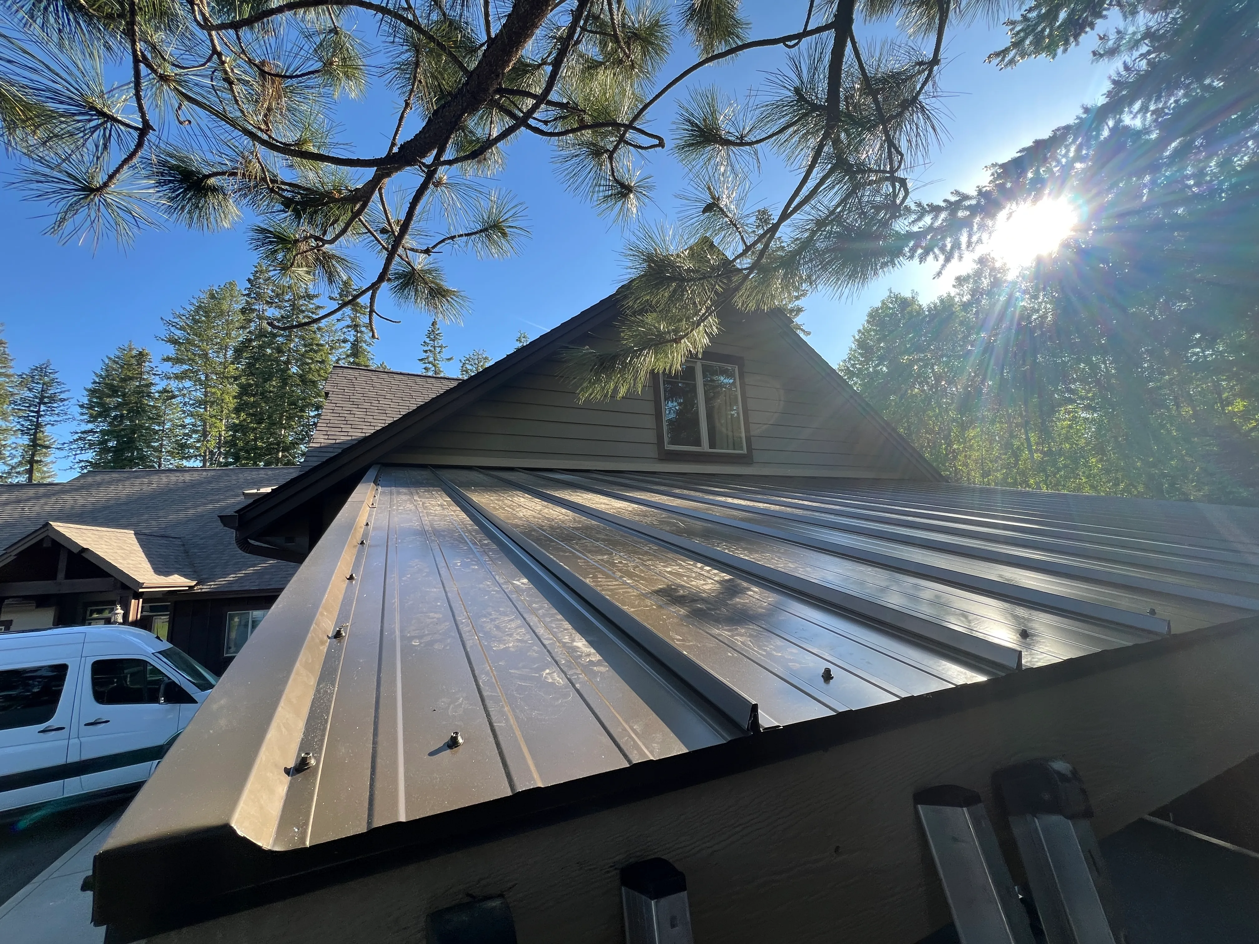 Standing-seam metal roof installed on lean-to