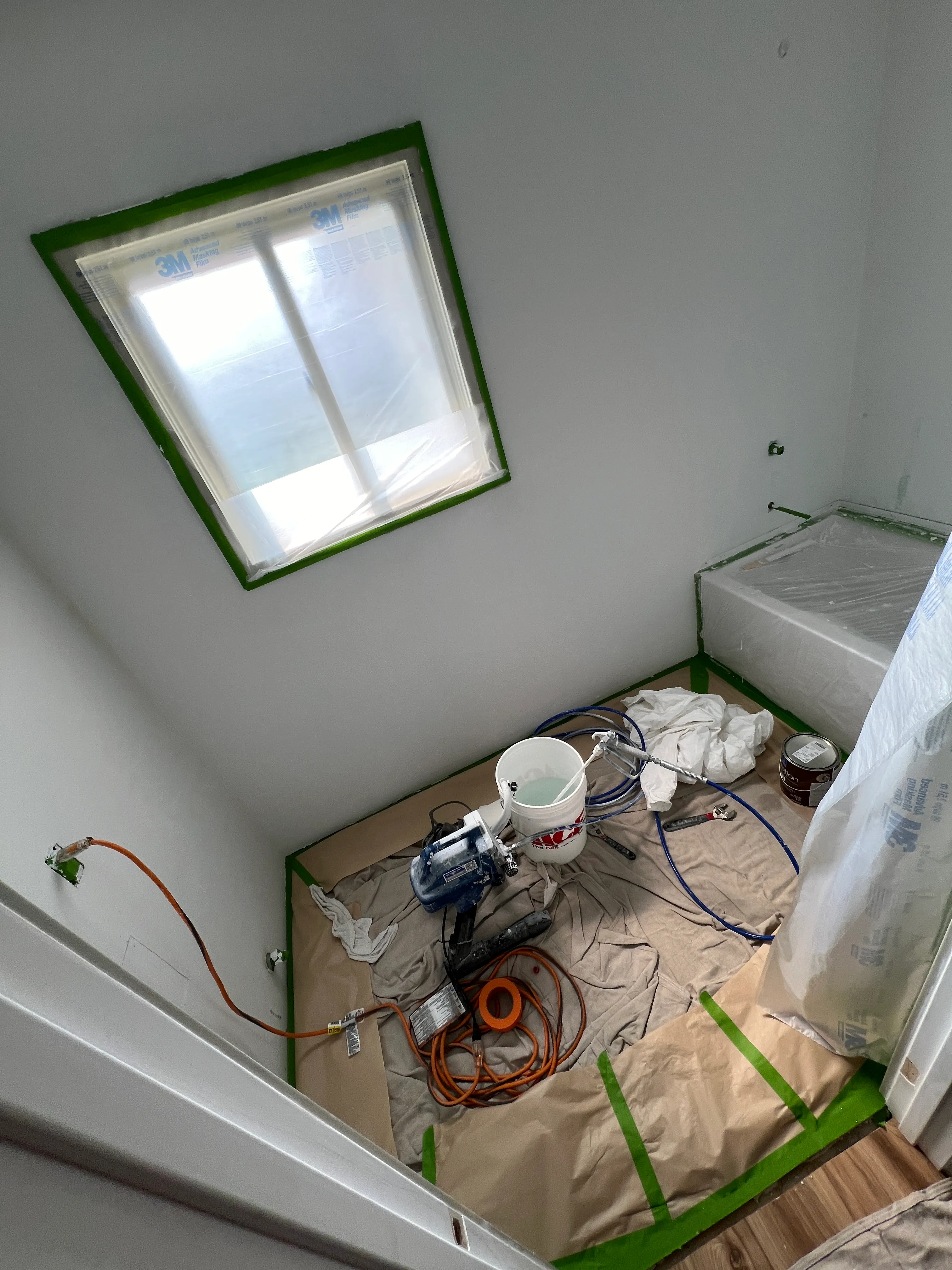 Room masked and prepped for spray texture