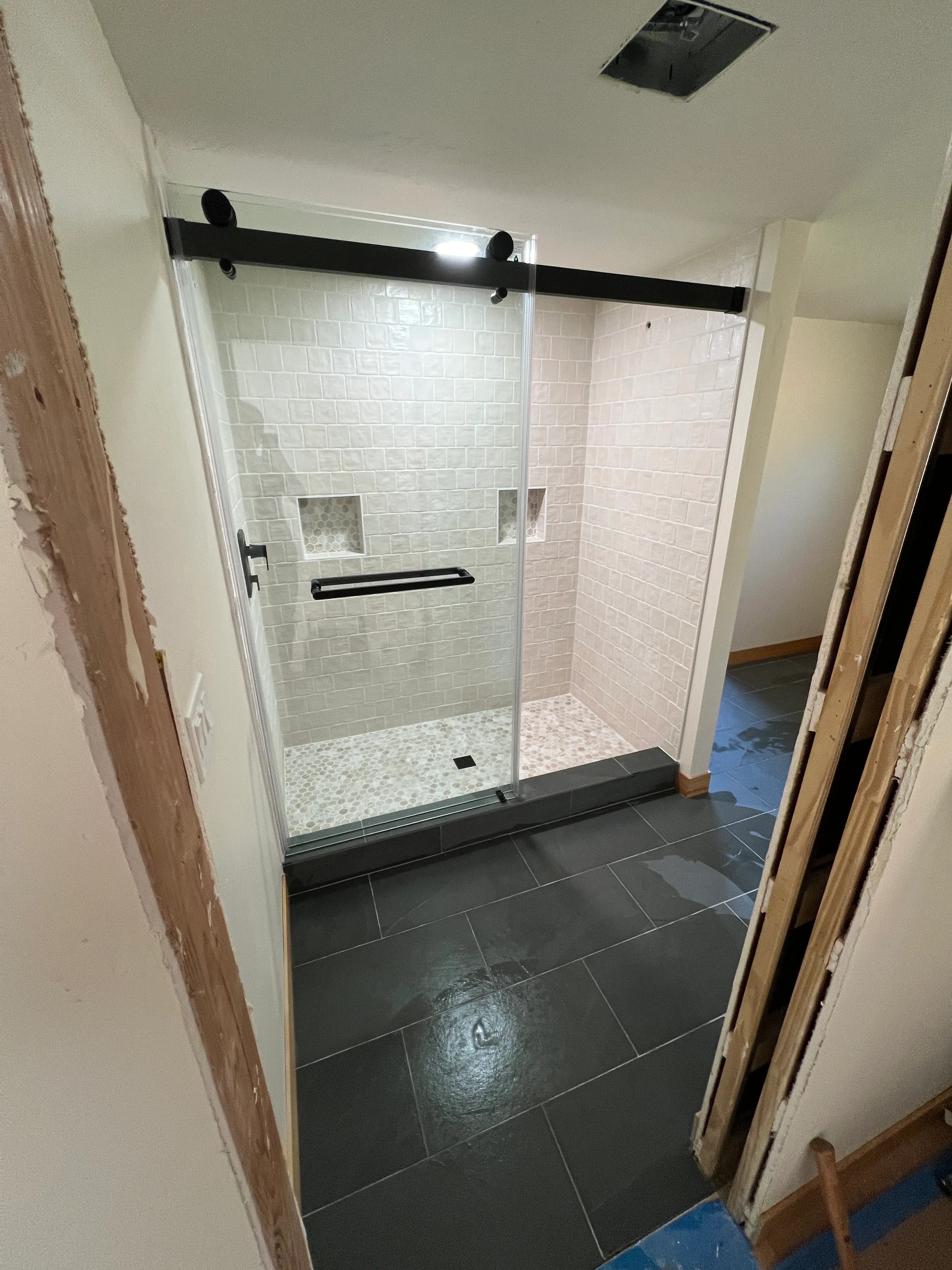 Completed shower with glass partition