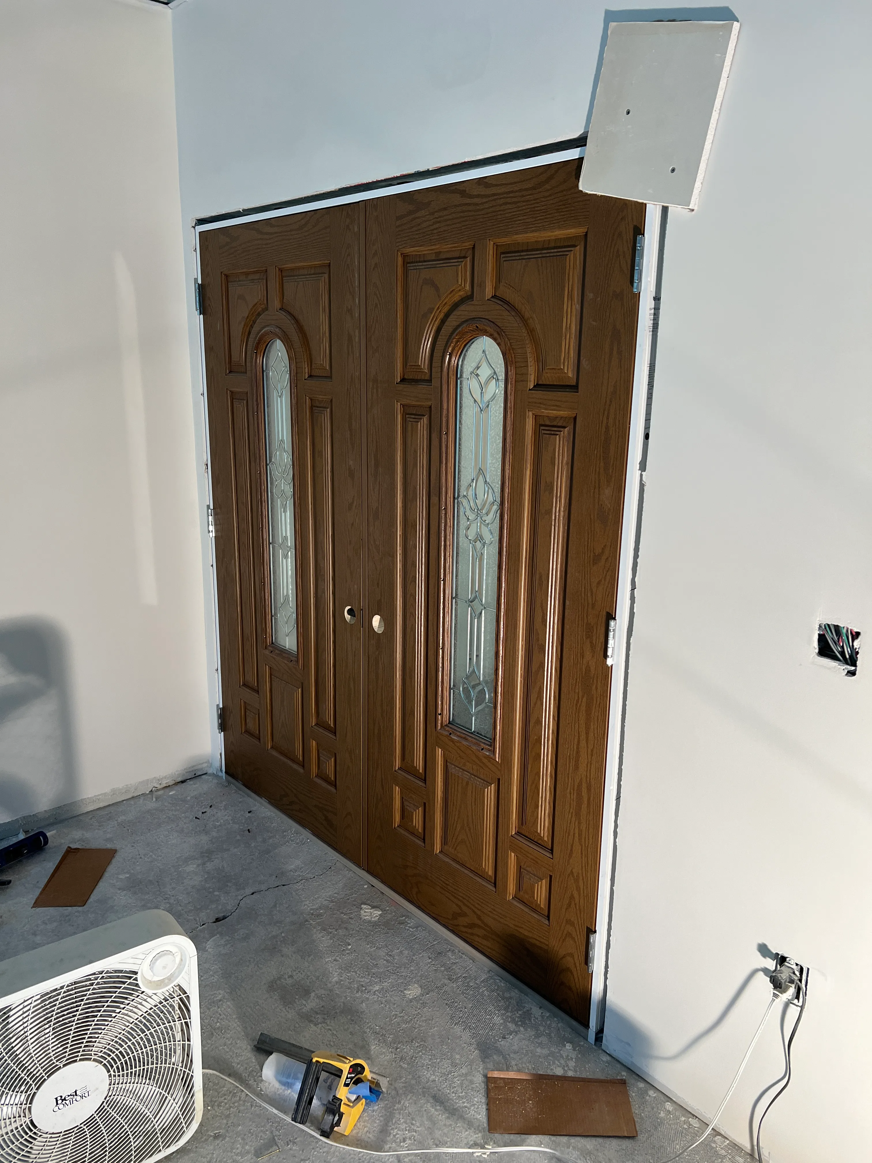 Oak double doors with leaded glass installed
